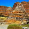 One of the Bungle Bungle's unique rock formations, called the Beehives. The black stripes are lichen (a fungus) and the orange is silica. Photo Credit: Jeff Miller.
