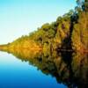 The Ord River at sunset -- a peaceful scene that belies the 	fact that numerous salt-water crocodiles live along its banks. Photo Credit: Jeff Miller.